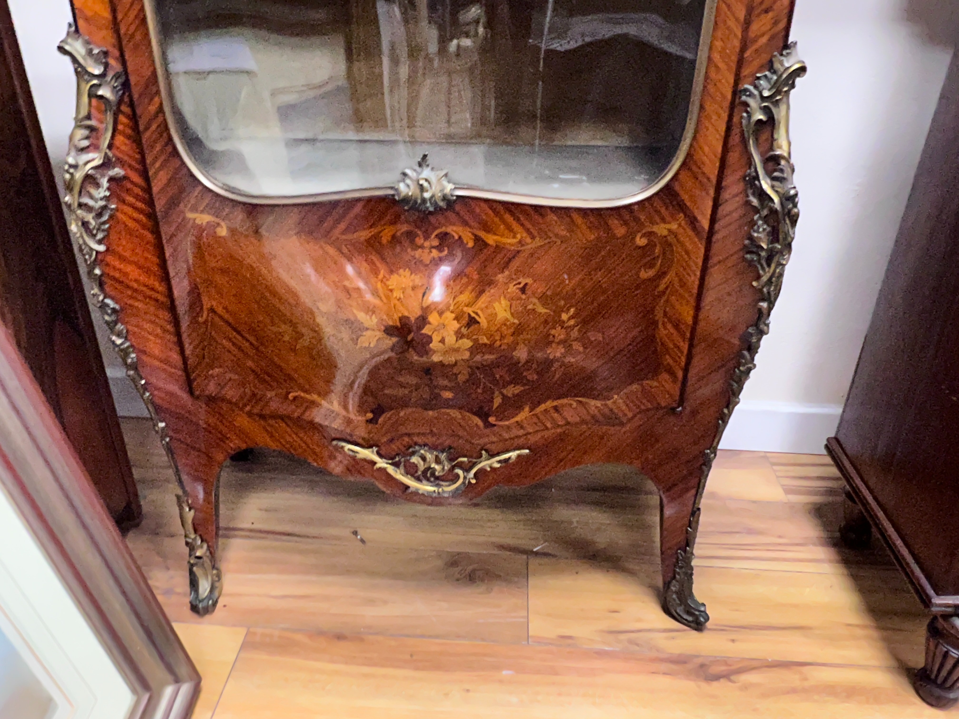 A Louis XVI style gilt metal mounted marquetry inlaid kingwood bombe vitrine, width 86cm, depth 40cm, height 160cm